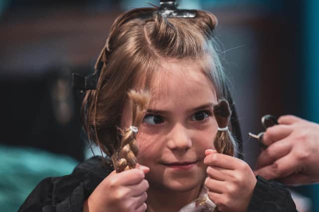 Eden, 7, says goodbye to her long locks. Photos: Ian Heslop