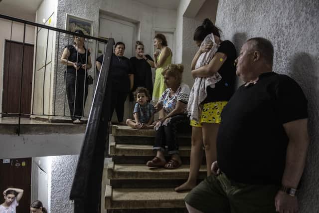 Israeli citizens shelter from a Hamas rocket lauch