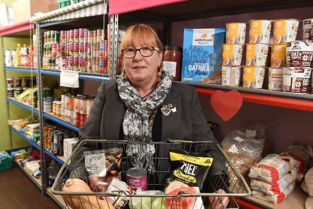Photo Neil Cross; Steph Lees-Pinson in the pantry at Intact, which gives families the chance to fill baskets for £5