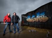 Graffiti artists Christian Seca One and Graham Morriss working on a crate on the Comedy Carpet to promote new Netflix movie Army of the Dead.