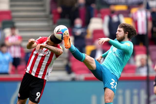 Bournemouth midfielder Ben Pearson challenged Brentford's Emiliano Marcondes