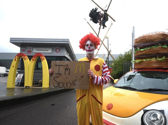 Animal Rebellion protester dressed as a clown
