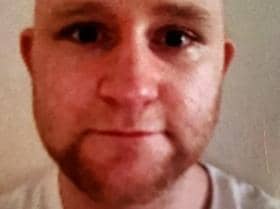 Daniel Astin (pictured) is described as white, around 5ft 10in tall, heavily built with a shaven head and facial hair.(Credit: Lancashire Police)