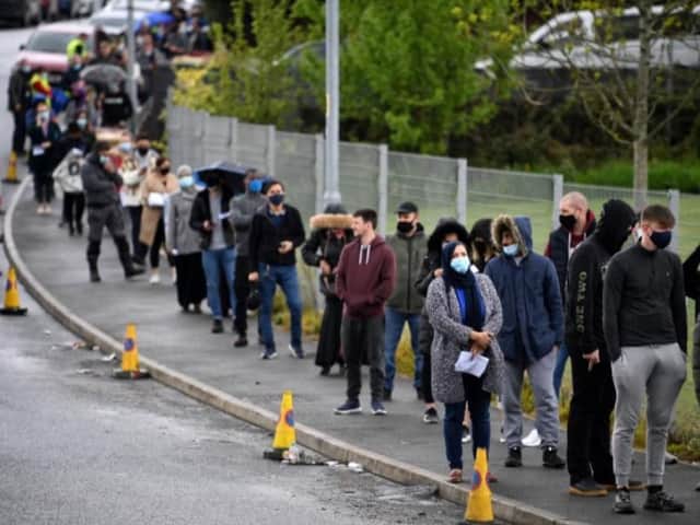 Queues for vaccination in Bolton which has the highest Covid rate in the country.