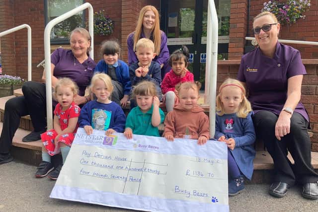 Children from Busy Bears Day Nursery paid a visit to Derian House staff to deliver funds raised during 20th anniversary celebrations.