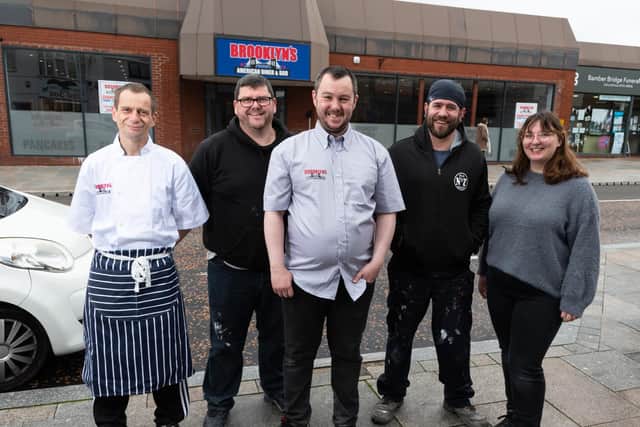 Manager Andy Bland (centre) and his staff are putting the finishing touches to Brooklyn's, the new American-themed diner at the old RBS bank in Station Road, which greets its first customers at 5pm on Friday (May 28)