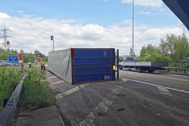 Highways England posted a picture on social media of the lorry on its side.