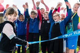 Frankie Garbett cuts the ribbon to get the Race For Life events at St Laurence CE Primary School, Chorley, started