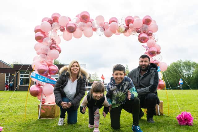 Sandra Kane, Frankie, Finlay and Dave Garbett at the Race For Life event at St Laurence CE Primary School in Chorley