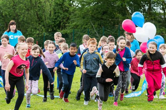 Frankie Garbett leads the way at the start of the Race For Life events at St Laurence CE Primary School, Chorley Photos: Kelvin Stuttard