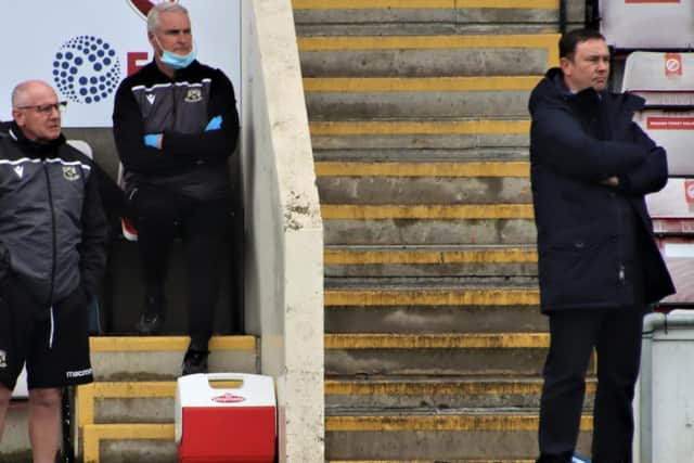 Derek Adams and his assistant, John McMahon, have Morecambe within one victory of a place in League One