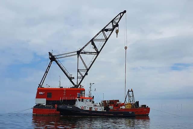The boat was raised using a 43-metre long crane barge and placed on the deck of an adjacent ship ready for transportation. (Image: MAIB)