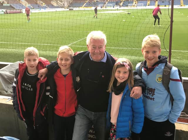 Stewart with his two youngest sons and his two grandchildren