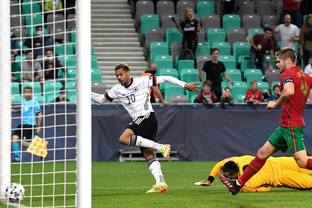 Lukas Nmchea scores Germany's winner against Portugal in the European Under-21s Championship final