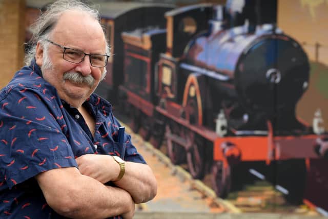 Ribble Steam Raiwlay & Museum chairman Dave Watkins pictured by one of the new murals.