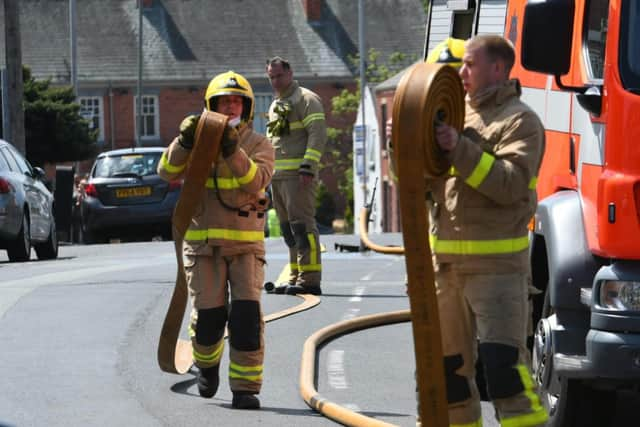 Firefighters at the scene in School Lane.