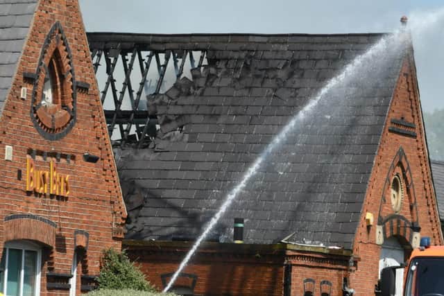 A section of the building's roof looks to have collapsed as a result of the fire.