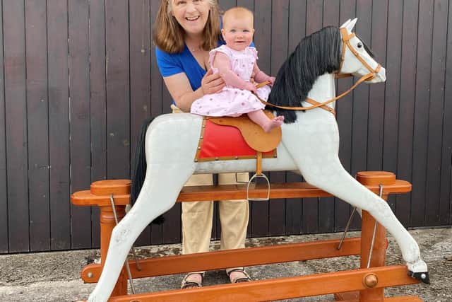 Sandra Cunningham with Sophia and the rocking horse