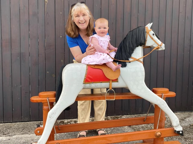 Sandra Cunningham with Sophia and the rocking horse