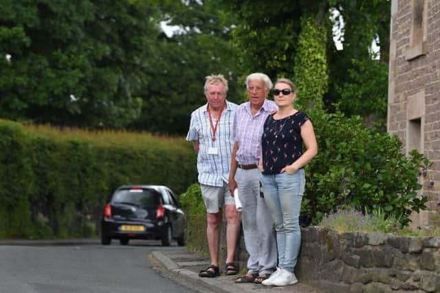 Ron Brimelow at the spot on Town Lane where his wife was injured, with his daughter Sheenan and Coun Gordon France