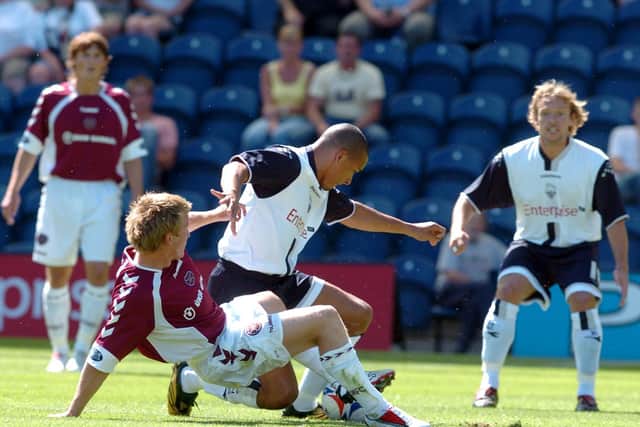 North End midfielder Jason Jarrett is tackled by a Hearts player