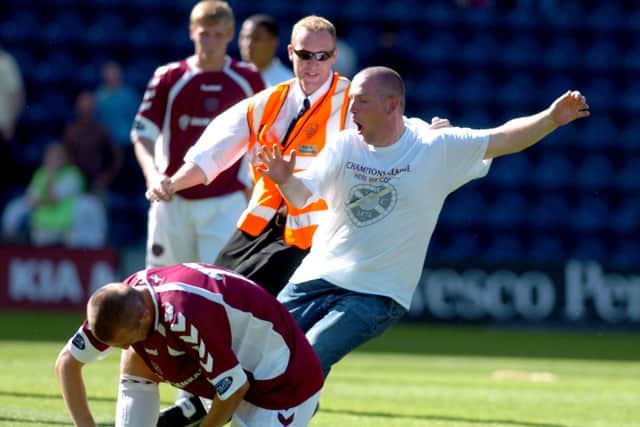 A Hearts pitch invader from the away end at Deepdale in 2006