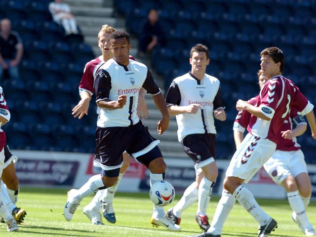 Preston North End winger Simon Whaley evades the attention of the Hearts defence to score at Deepdale in July 2006