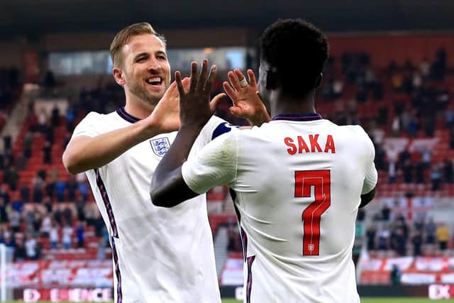 England's Bukayo Saka (right) celebrates with team-mate Harry Kane after scoring their side's first goal of the game during the International Friendly at The Riverside Stadium, Middlesbrough.  Wednesday June 2, 2021. 
PHOTO: Lindsey Parnaby/PA Wire.
