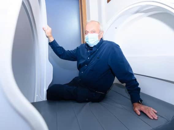 MD Andrew Hall tries out a sleep pod.