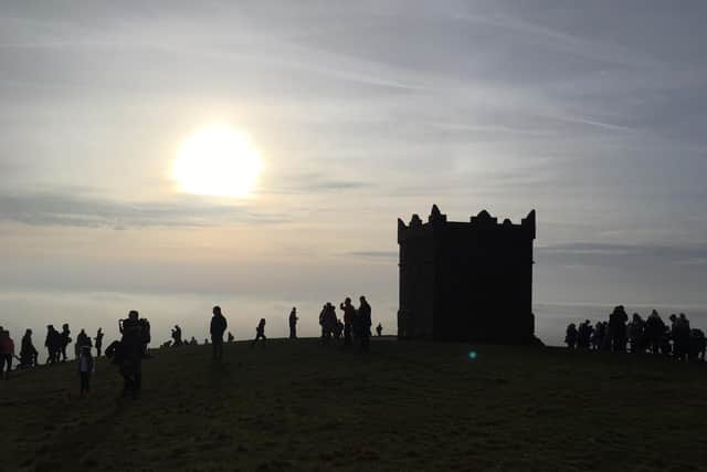 This atmospheric photograph by reader Tony Nolan shows visitors at the Pike