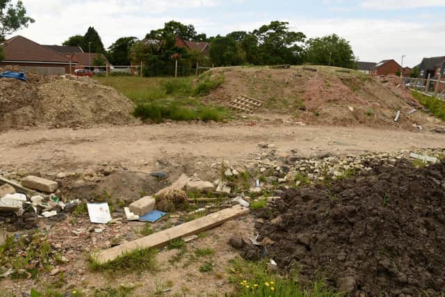 Nearby residents had hoped that the former compound area on the site would have been cleared up by now