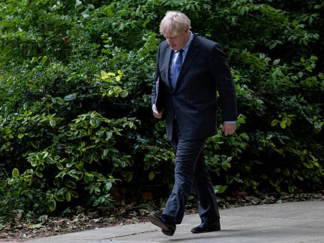 Boris Johnson returns to 10 Downing Street after giving a press conference on June 14