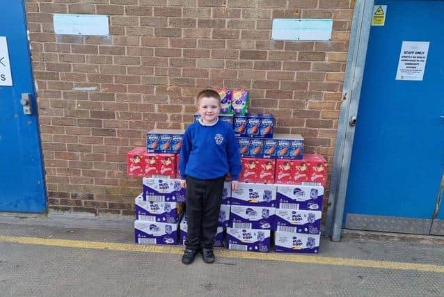 Alfie with the Easter eggs he bought for Burnley Community Kitchen