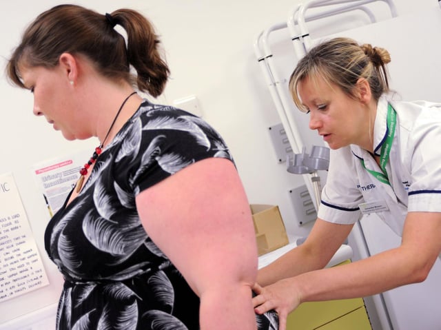 Samantha Musson, team leader in the Women's Health and Continence Physiotherapy, works with Tori Draper.