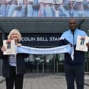 Author Susan Quinn with Manchester City ex-goalie Alex Williams MBE - and her late dad's beloved team scarf - outside the Etihad Stadium.