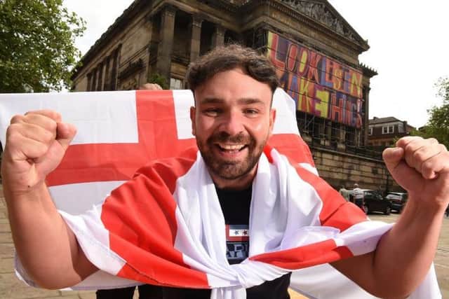 Jonathan Halton of Preston BID prepares for the England v Scotland match to be shown on the giant screen on Preston's Flag Market