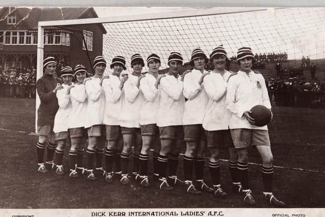 The Dick, Kerr team with Lily Parr at the front holding the ball