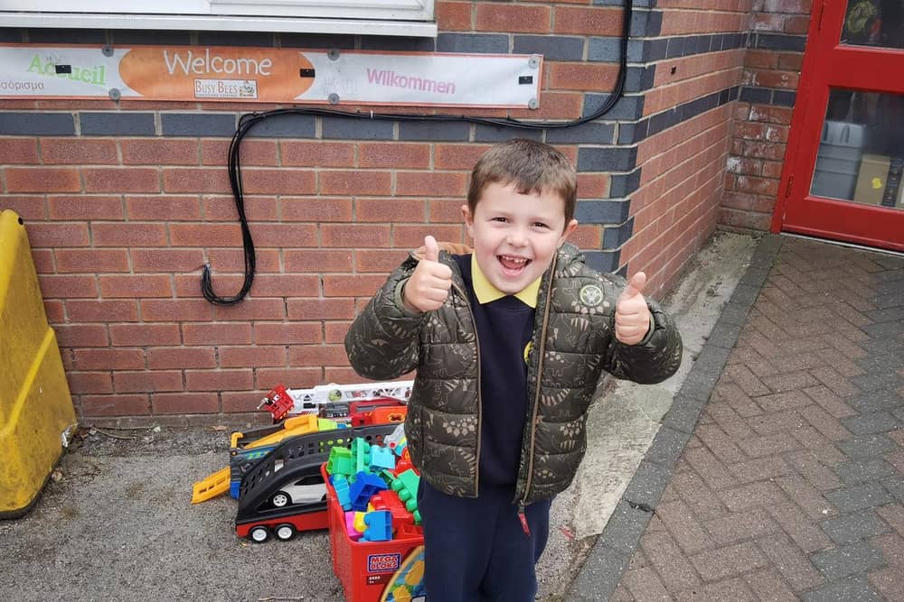 Leo with the toys he donated