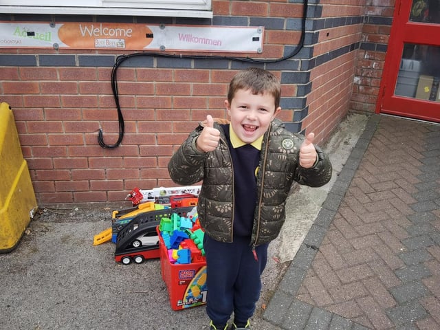 Leo with the toys he donated