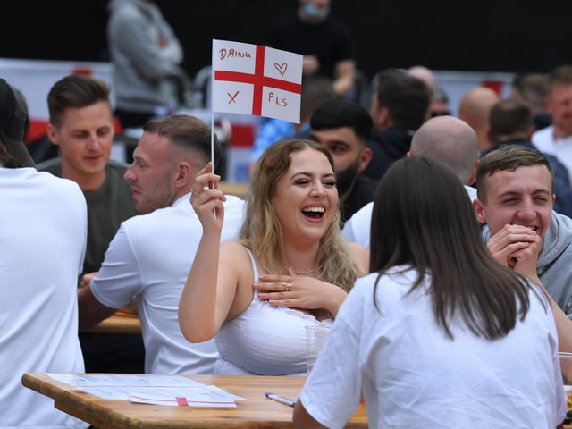 Fans watching the England v Scotland match at Flag Market Fans Zone