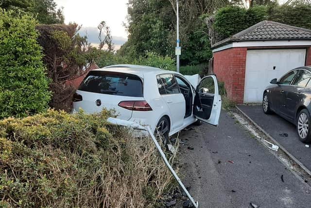 On the driveway, a white Volkswagen Golf had mounted the pavement and smashed into the back of a Ford Fiesta, causing extensive damage to both cars. Pic: Shane King