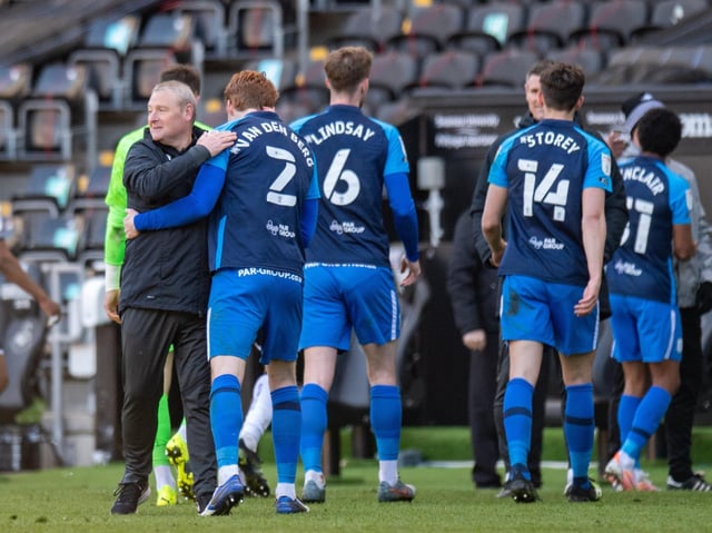 PNE head coach Frankie McAvoy with some of the players after last season's win at Swansea