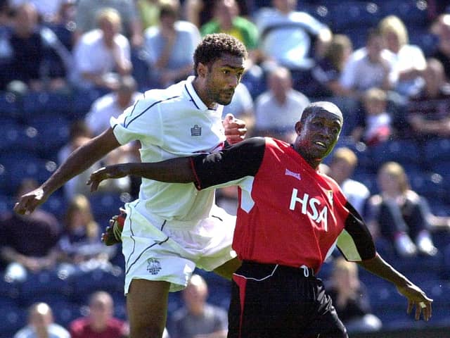 Youl Mawene challenges Blackburn's Dwight Yorke during his first appearance for Preston North End in August 2004