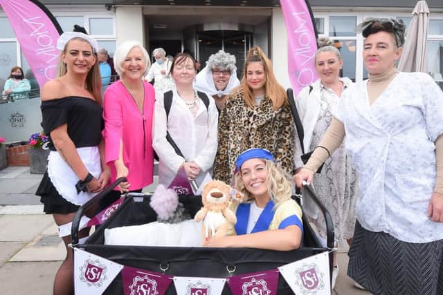 Sheraton Hotel manager Liz Brown (in pink) pictured with her housekeeping team. She said was 'so proud' after raising nearly £2,000 for charity.