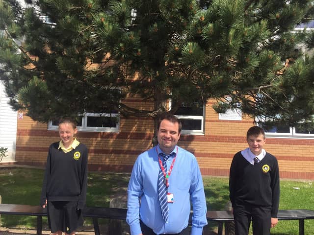 Summer school leader and 2nd in Maths Mr Fern and two volunteers from the school , Holly Moffatt and Theo May.