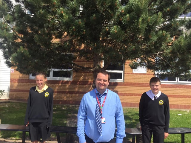 Summer school leader and 2nd in Maths Mr Fern and two volunteers from the school , Holly Moffatt and Theo May.