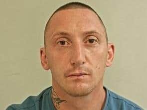 Preston man Oliver Bland, 38, is wanted in connection with a number of offences, including an assault in Bamber Bridge last weekend, where a man had his ear bitten off. Pic: Lancashire Police
