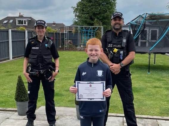 Niall, from Tarleton, was nominated for a Little Hero award after he helped an elderly lady who had fallen in her garage. (Credit: Lancashire Police)
