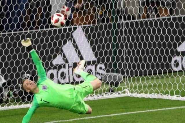Former PNE keeper Jordan Pickford pulls off a one-handed save Carlos Bacca's spot-kick in the shoot-out with Colombia.