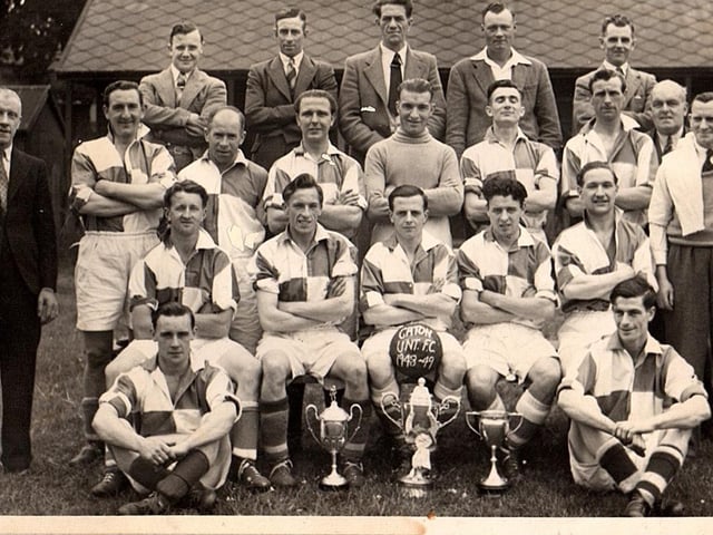 Photograph of Caton United 1948-1949 at Jowett’s Field, Caton, with a clean sweep of trophies won in that season, Division1 title, Parkinson Cup & Senior Challenge Cup.Back row from left: Dick Woolcock, George Wilson, Stanley Walker, Bill Dainty, George Robinson. Middle row from left: Tom Eglin, Bill Hodgson, Jimmy Till, Jimmy Clarkson, Bert Cartmel, Albert Robinson, R. Bowker, Ritson Stockdale, Sid Southward
Front row from left: Fred Robinson, Joe Easterby, Jock Kerr (captain), Ted Fairclough, Cyril Gardner. Sat on the ground from left: Jimmy Mason, Frank Woodhouse.